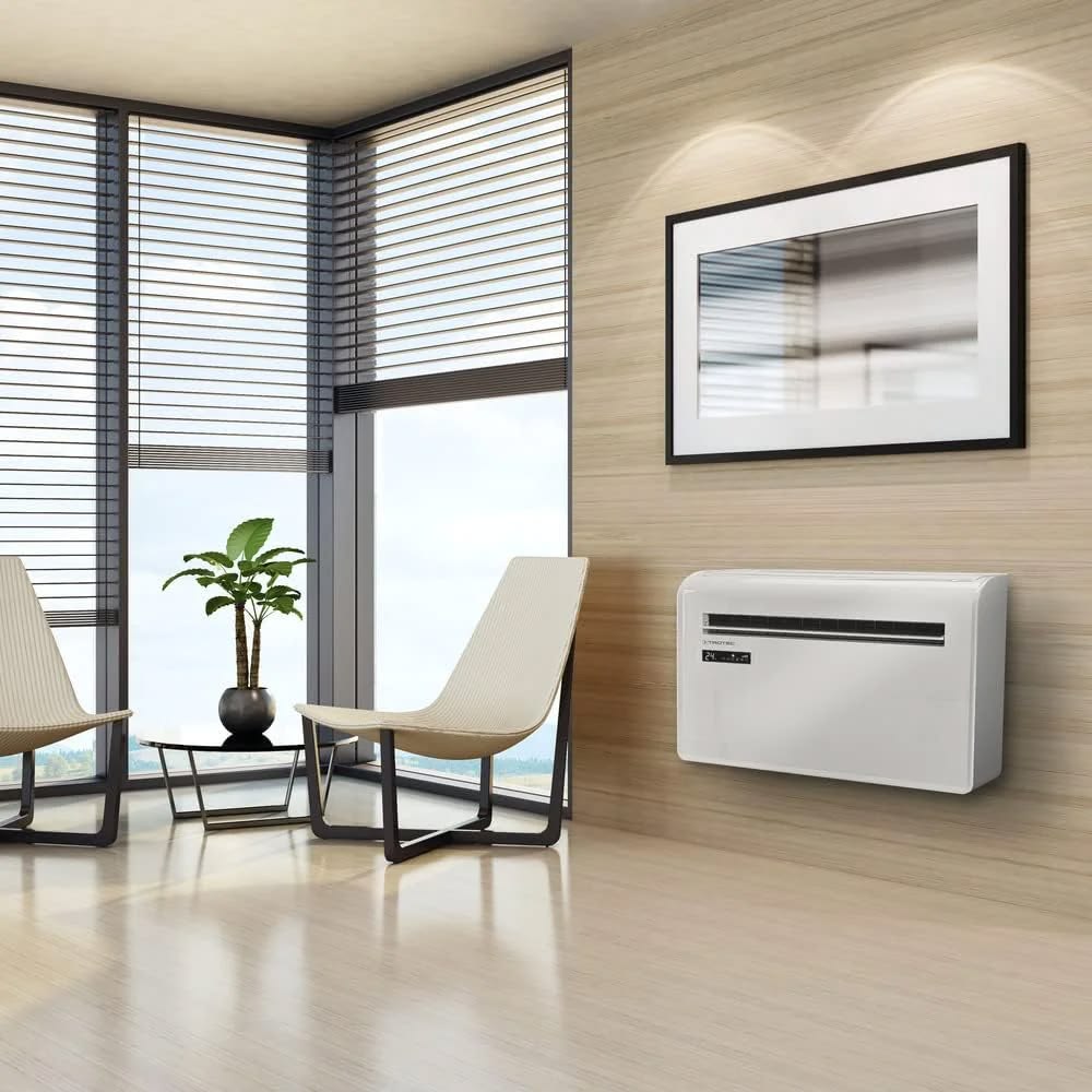 Wall mounted air conditioner heater unit installed on a white wall, 2-in-1 cooling and heating function, compact and energy efficient design