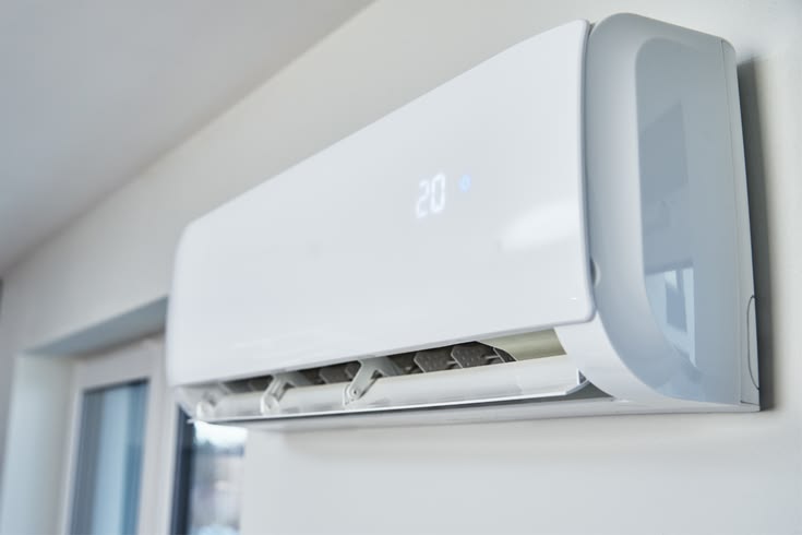 Wall mounted air conditioner heater with 2-in-1 cooling and heating features in a compact design
