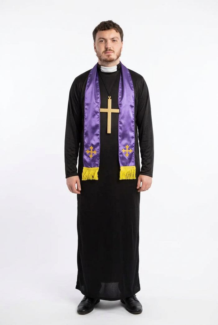 A man wearing a black priestly habit and a purple liturgical stole with gold embroidery and a large gold cross pendant, standing in front of a stone archway.