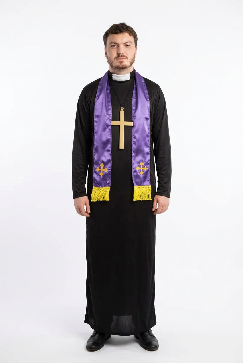 A man wearing a black priestly habit and a purple liturgical stole with gold embroidery and a large gold cross pendant, standing in front of a stone archway.