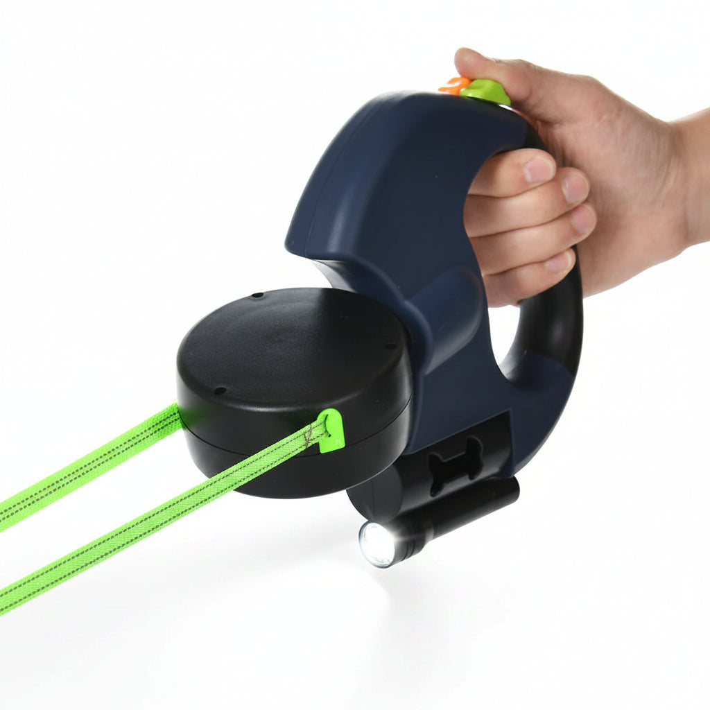 Hand holding a blue retractable dog leash with green and orange options on a white background
