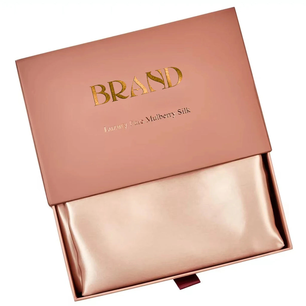 Rose gold box with 'BRAND' embossed on the lid against a white background