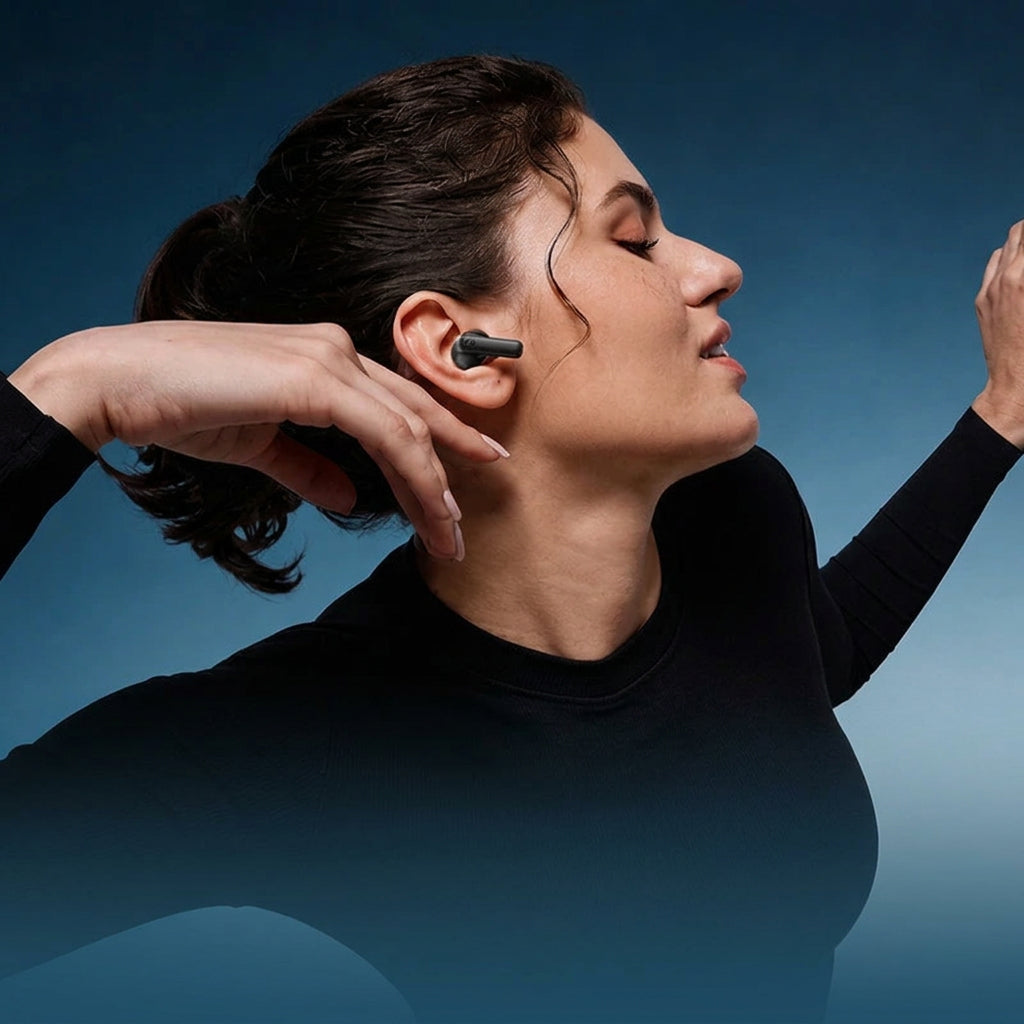 Woman wearing wireless earbuds with text about ergonomic snug and secure fit.