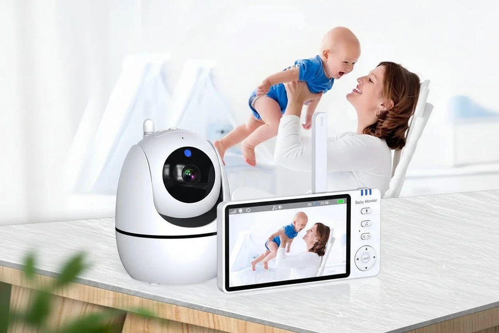 Baby monitor with camera and display showing a mother and baby, with text about intelligent monitoring.