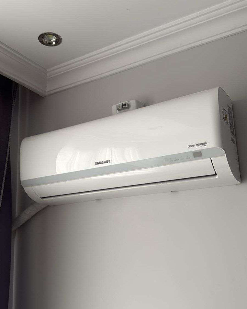 Wall mounted air conditioner heater unit installed on wall with remote control showing 2-in-1 cooling and heating functionality in a modern room