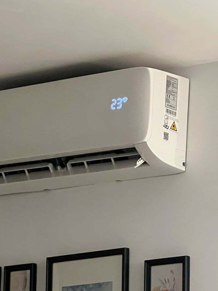 Wall mounted air conditioner heater unit installed on a wall for cooling and heating